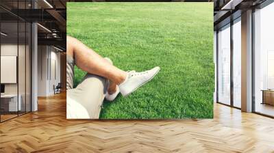 man resting outdoor on a grass field Wall mural