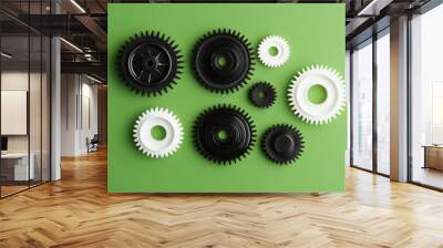 Models of plastic gears on a green background. Wall mural