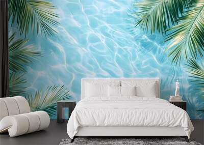 Light blue water background with palm leaves and ripples, swimming pool water, light aquamarine, tropical beach Wall mural