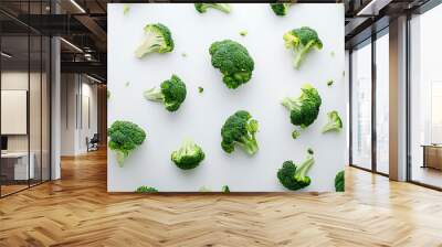 Perfectly Trimmed Broccoli Florets Against White. Wall mural