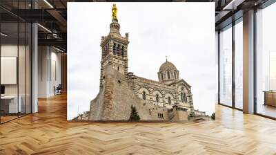 The basilica of Notre Dame de la Garde in Marseille, built in Neo-Byzantine style, At top of the bell tower there is s a golden statue of the Madonna and Child Wall mural