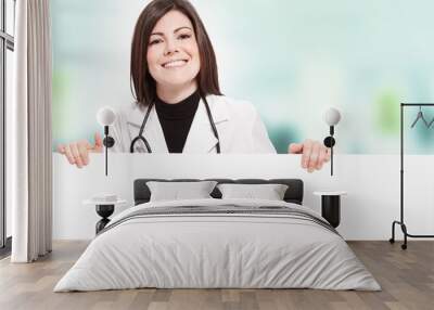 smiling female doctor with message board Wall mural