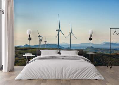 Turbines in a mountain wind farm. Ecological energy production. Wall mural