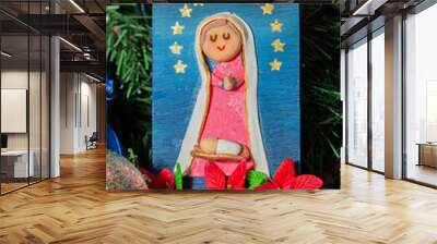 Handmade decorations for Christmas tree, Virgin Mary with Easter flowers and painted in relief. Wall mural