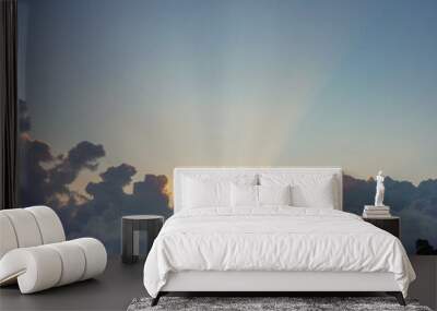 Sunrays over cloudy sky. Wall mural