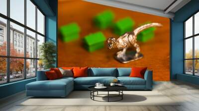 T-rex scene with small houses around Wall mural