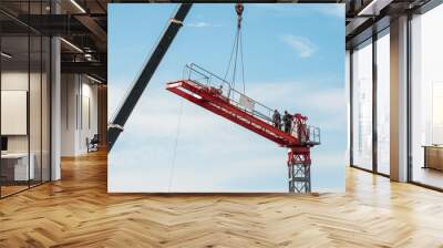 Assembly of a construction crane. Wall mural