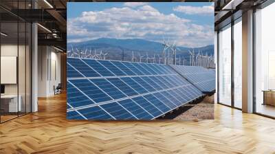 Solar panels and wind turbines in sunny desert Wall mural