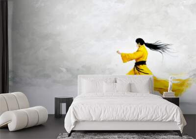 Martial artist wearing yellow outfit practicing kung fu Wall mural