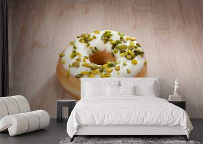 Single delicious donut on wood Wall mural