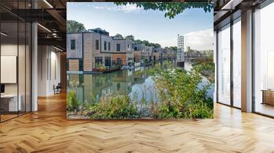 rotterdam, the netherlands, october 12, 2022: row of floating villas with wooden facades in an old h Wall mural