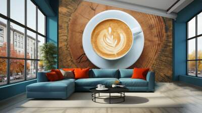 Close up of fresh aromatic cappuccino coffee on a wooden surface. Wall mural