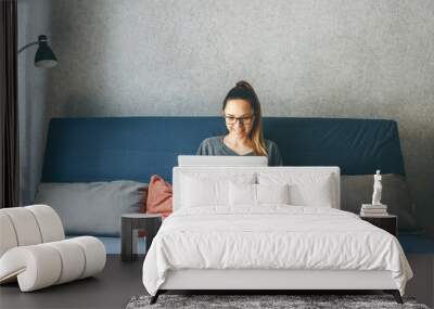 Girl working on laptop Wall mural