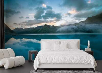 amazing clouds during sunset in the mountains and a lake (Montafon, Vorarlberg, Austria) Wall mural