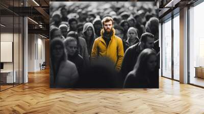 1 person in full bright colour and saturiattion standing among a crowd of people in black and white Wall mural