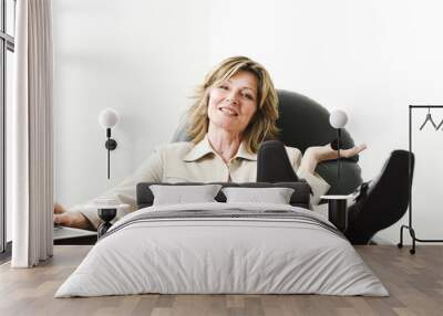 business woman relaxing in board room Wall mural