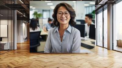 mature asian woman professional in casual dress in an accounting office Wall mural