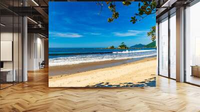 Rmote wild beach of Castelhanos and its paradisiacal tropical landscape on the island of Ilhabela in Sao Paulo Wall mural