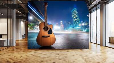 Guitar on night city background Wall mural