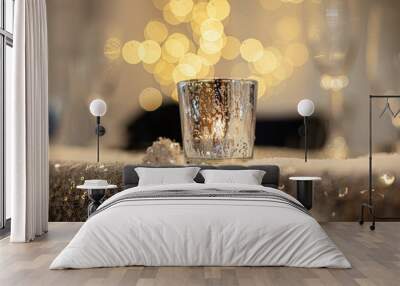 Gold candle on glitter surface with round bokeh background Wall mural