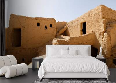 Abandoned houses in the traditional construction of Arabic adobe architecture in Qusur al Muqbil near Riyadh in Saudi Arabia Wall mural