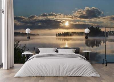  lake with a misty sunrise over the trees. Wall mural