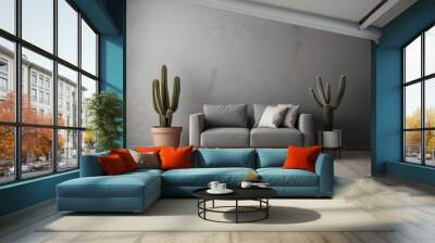 Grey Sofa with Two Cacti Plants and White Pillows in a Room with a Grey Wall and Wooden Floor Wall mural