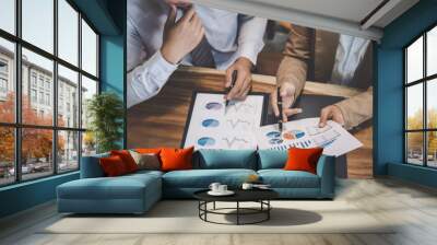 Business team working with new startup project plan and discussion information for financial strategy with laptop and digital tablet in a modern business lounge Wall mural