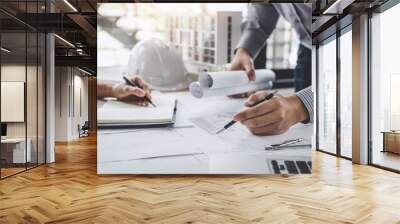 Construction and structure concept of Engineer or architect meeting for project working with partner and engineering tools on model building and blueprint in working site Wall mural