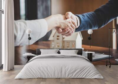 Estate agent and customer shaking hands after finished contract after about home insurance and investment loan Wall mural