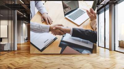 Greeting new colleagues, Handshake while job interviewing, male candidate shaking hands with Interviewer or employer after a job interview, employment and recruitment concept Wall mural