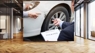 Man agent Filling Insurance Form Near Damaged and examining Car, Traffic Accident and insurance concept Wall mural