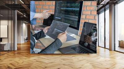 Two professional programmer cooperating and working on web site project in a software developing on desktop computer at company, codes and typing data code, Programming with HTML, PHP and javascript Wall mural