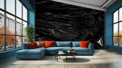 a transparent plastic wrap on black background. realistic plastic wrap texture for overlay and effect. wrinkled plastic pattern for creative and decorative design. Wall mural