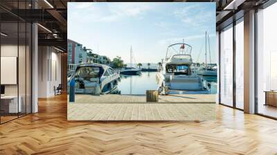 Large white yachts on the background of comfortable hotels. Wall mural