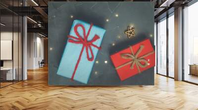 Three Christmas presents on the concrete floor.Holiday, new year and womens day. Wall mural