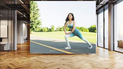 Athletic woman practicing sport outdoor Wall mural