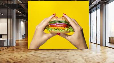 Close up view tasty burger on yellow background Wall mural