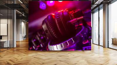 Dj mixer with headphones at a nightclub Wall mural