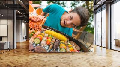 Teenagers during a barbecue at family garden BBQ Wall mural