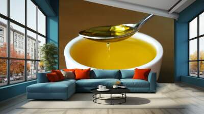 Natural olive oil in a spoon Wall mural