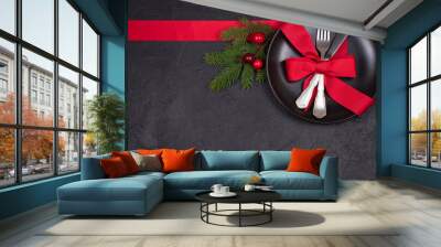 Christmas table setting with plate, cutlery, red ribbon and berries. Winter holidays and festive background. Christmas eve dinner, New Year food lunch. View from above, top, horizontal Wall mural