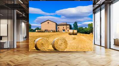 Beautiful countryside landscape with hay rolls and farm houses in Tuscany. Italy Wall mural