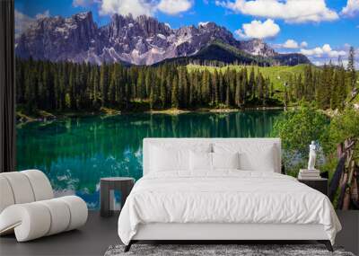 Idyllic nature scenery- trasparent mountain lake Carezza surrounded by Dolomites rocks- one of the most beautiful lakes of Alps. South Tyrol region. Italy Wall mural