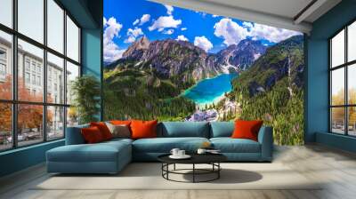 south Tyrol, Italy .  One of the most beautiful mountain Alpine lakes - magic Lago di Braies, sorrounded by Dolomites mountains. aerial drone panoramic view. Wall mural