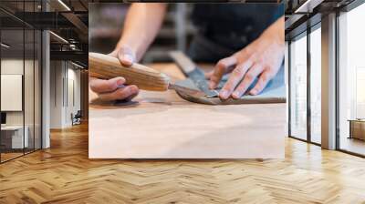 Hands of a precise ceramist is cutting wet clay and modeling it at pottery studio Wall mural