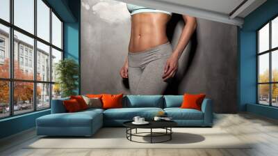 Fitness female woman with muscular body, do her workout, abs, ab Wall mural