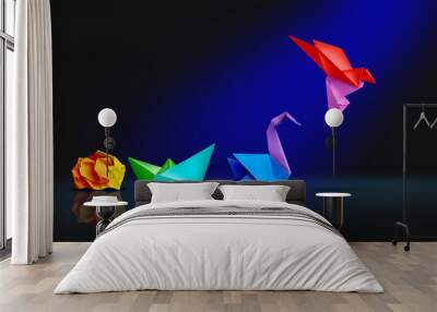 Transform and success or changing to succeed concept and leadership in business through innovation and evolution of ability as a crumpled paper transforming into a boat then a swan and a flying bird Wall mural