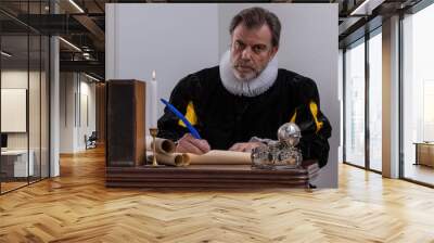 Recreation of a writer of the Spanish Golden Age (1492 to 1659), writing at his desk Wall mural