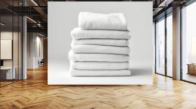 A stack of folded white towels on a table. AI image. Wall mural